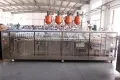 Сервоприводная машина для упаковки в готовые пауч-пакеты с четырьмя наполнительными головками